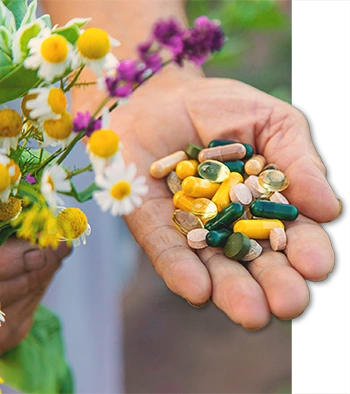 Woman holding multivitamins in her hand